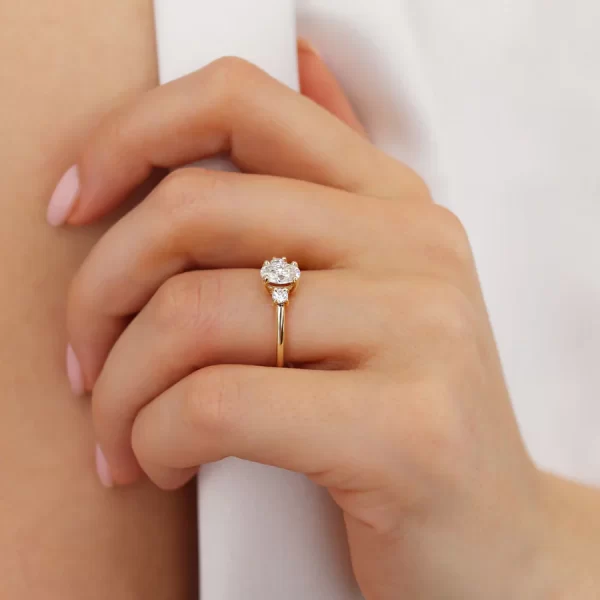 LOUELLA Moissanite Oval Petite Trilogy Engagement Ring 18k Yellow Gold - Image 5